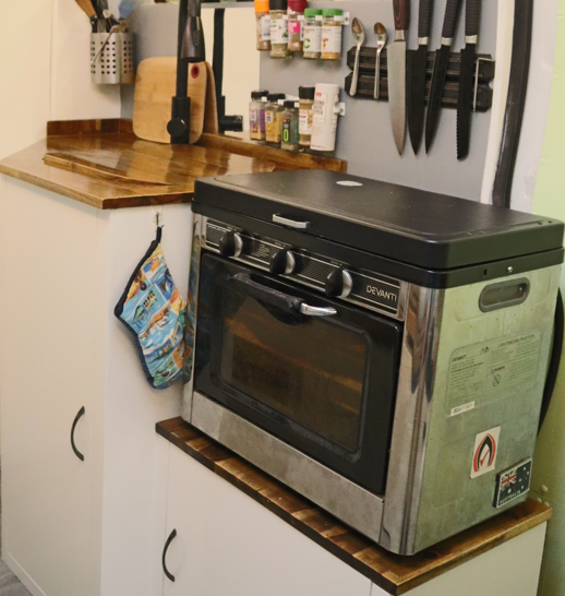 Portable oven and stove in my van kitchen
